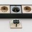W6514944 Розеточный блок 4-х местный + 3 USB черный шампань рифленый